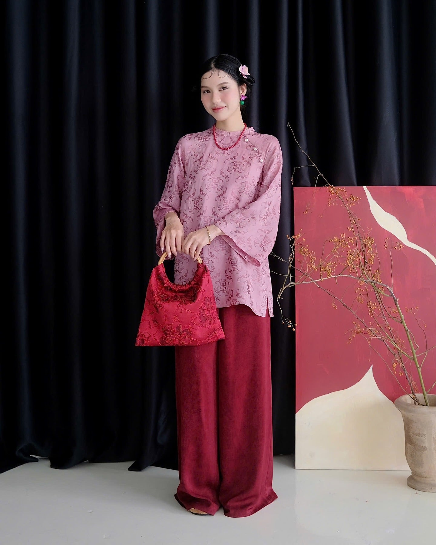 "Tra My Mandarin-neck Top in light pink woven silk, modern pattern, cultural authenticity"