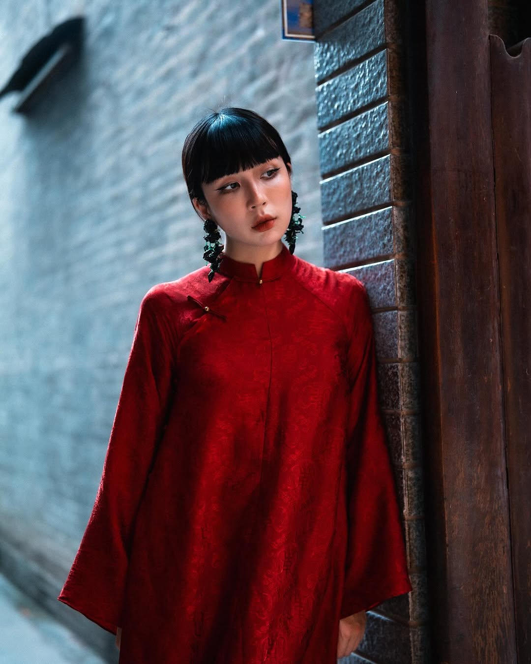 "Hy Loan Ao Dai set in crimson silk by Lalin, traditional Vietnamese dress"