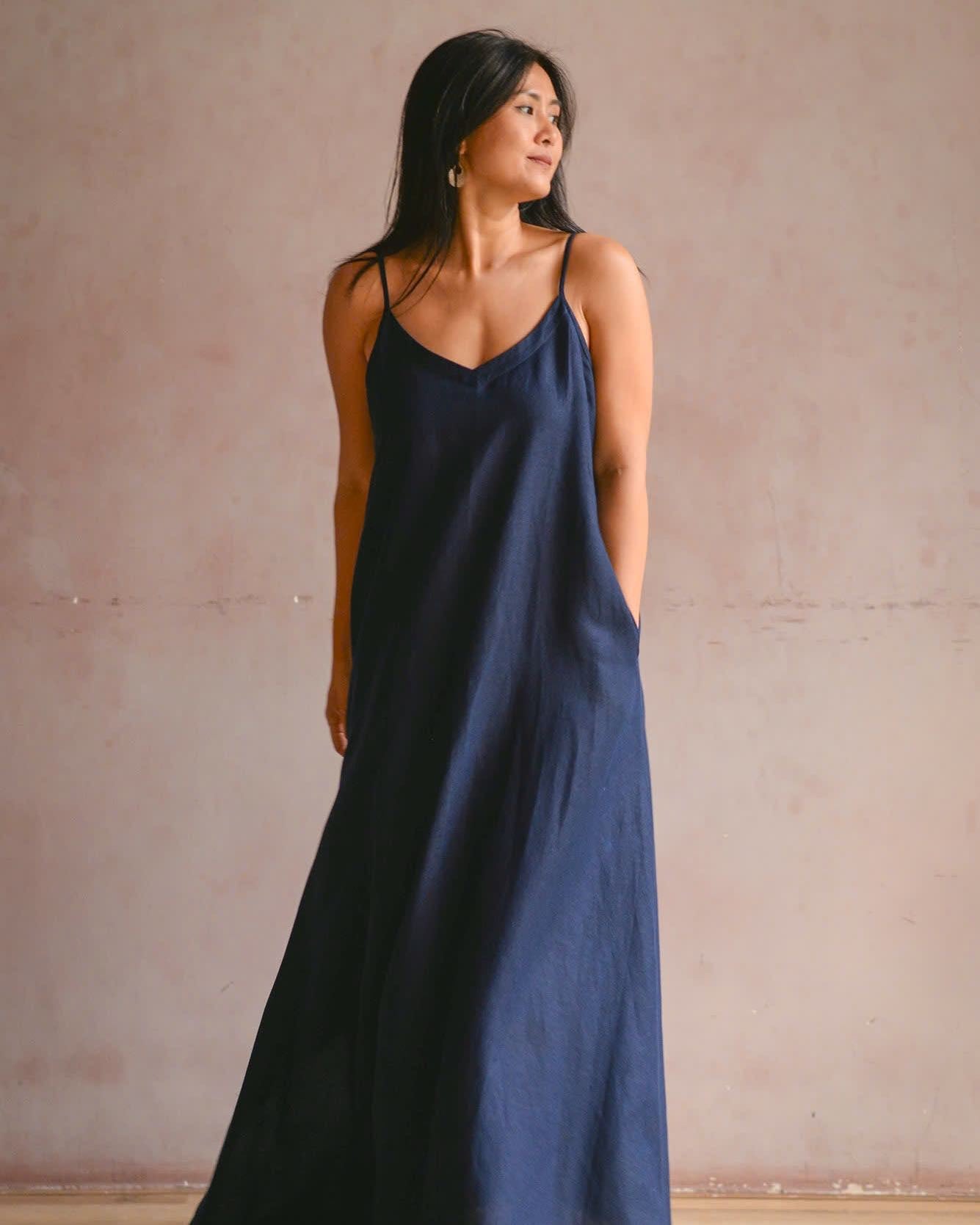 "Navy linen maxi dress 'Slide' by Turmeric, elegant sleeveless design, perfect for summer."