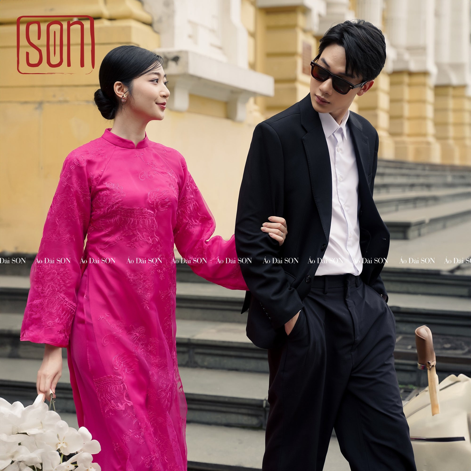 "Yen Son embroidered Ao Dai set in magenta silk with floral jacquard, traditional Vietnamese wedding dress."