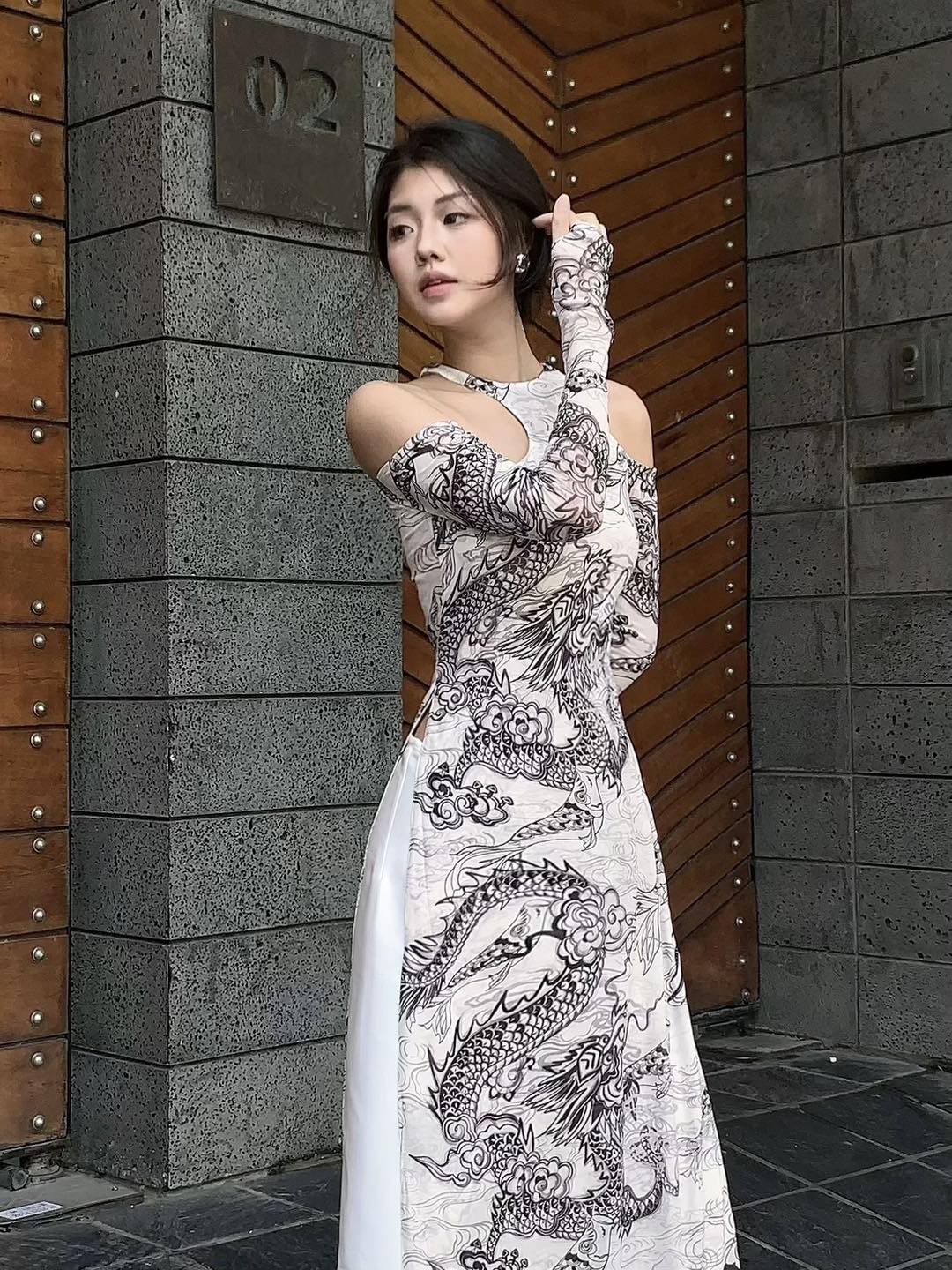 "Jia Chen Tulle Ao Dai Set in black with traditional dragon pattern, Vietnamese dress by Keira Tong."
