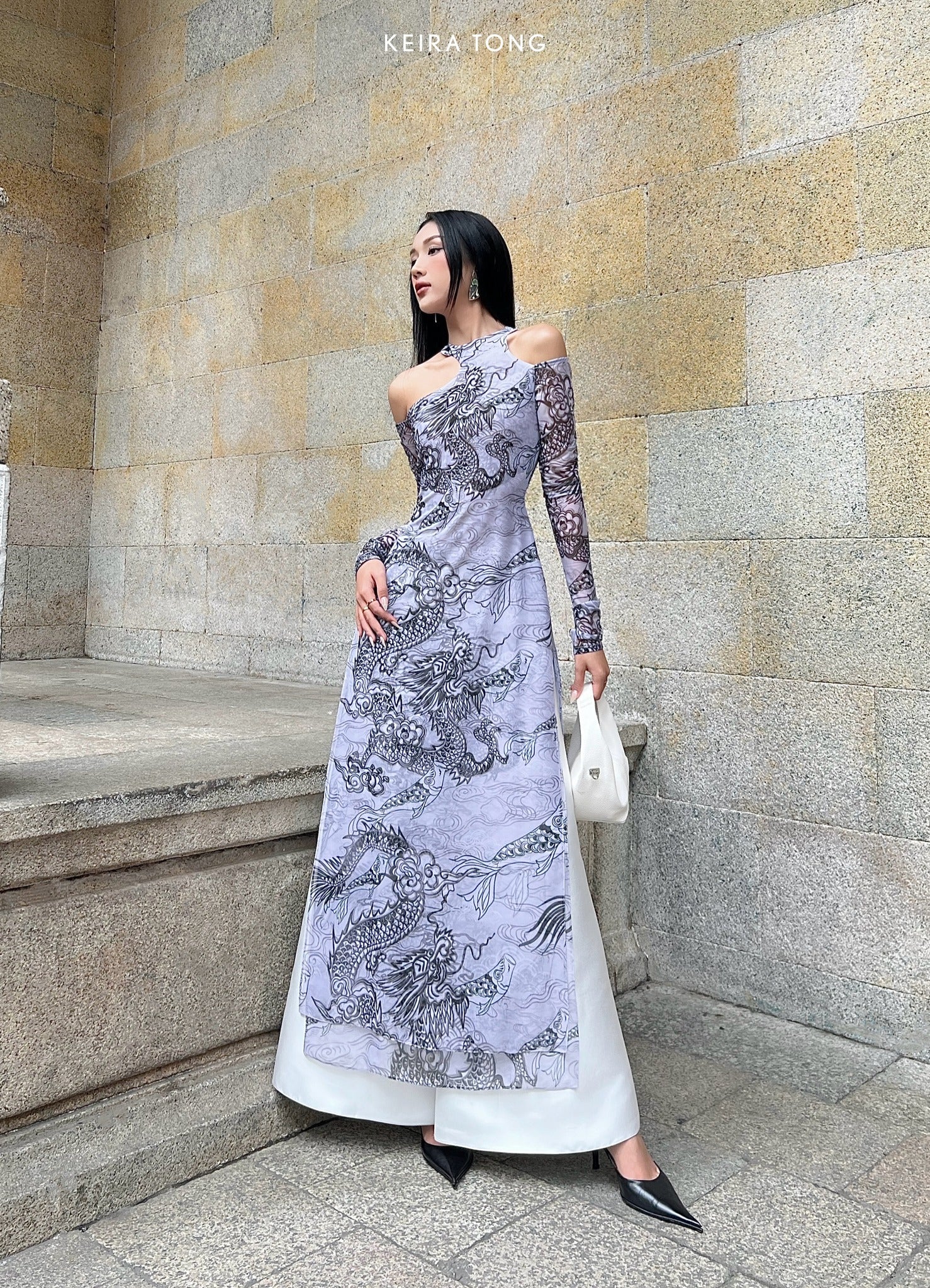 "Jia Chen Tulle Ao Dai Set in Black by Keira Tong, traditional Vietnamese dress with modern dragon pattern, off-shoulder design."