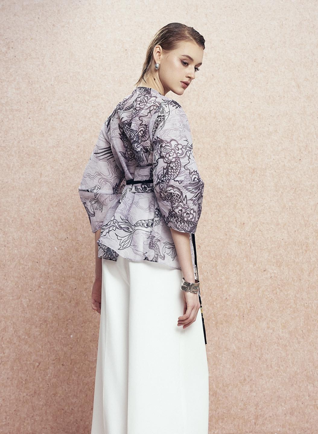 "Vĩ Kimono Top by Keira Tong in black silk organza with traditional patterns, modern design."