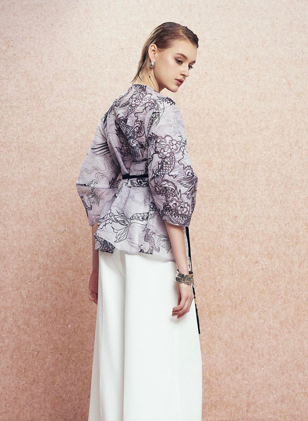 "Vĩ Kimono Top by Keira Tong in black silk organza with traditional patterns, modern design."