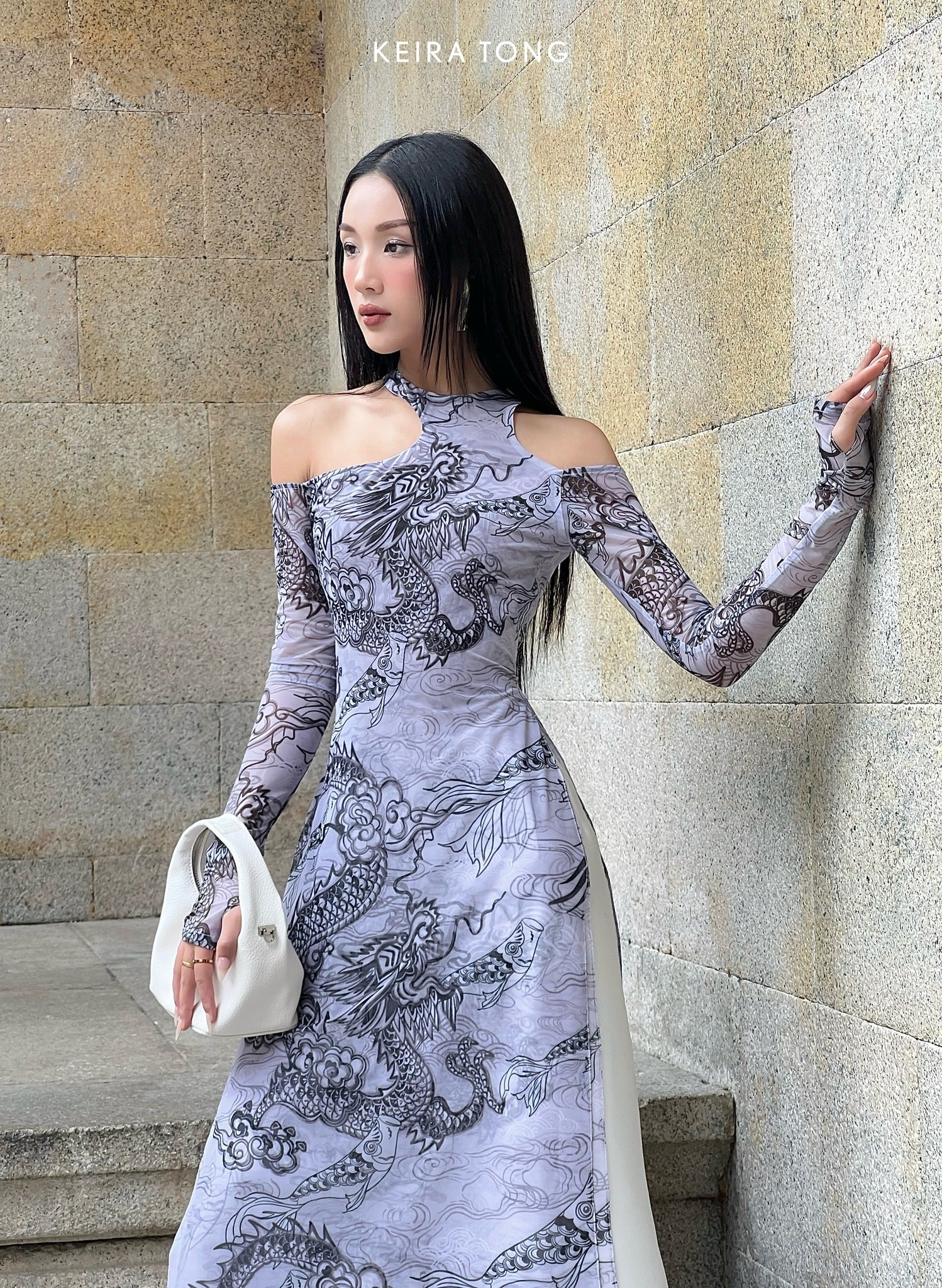 "Jia Chen Tulle Ao Dai Set in Black by Keira Tong, traditional Vietnamese dress with modern dragon pattern."