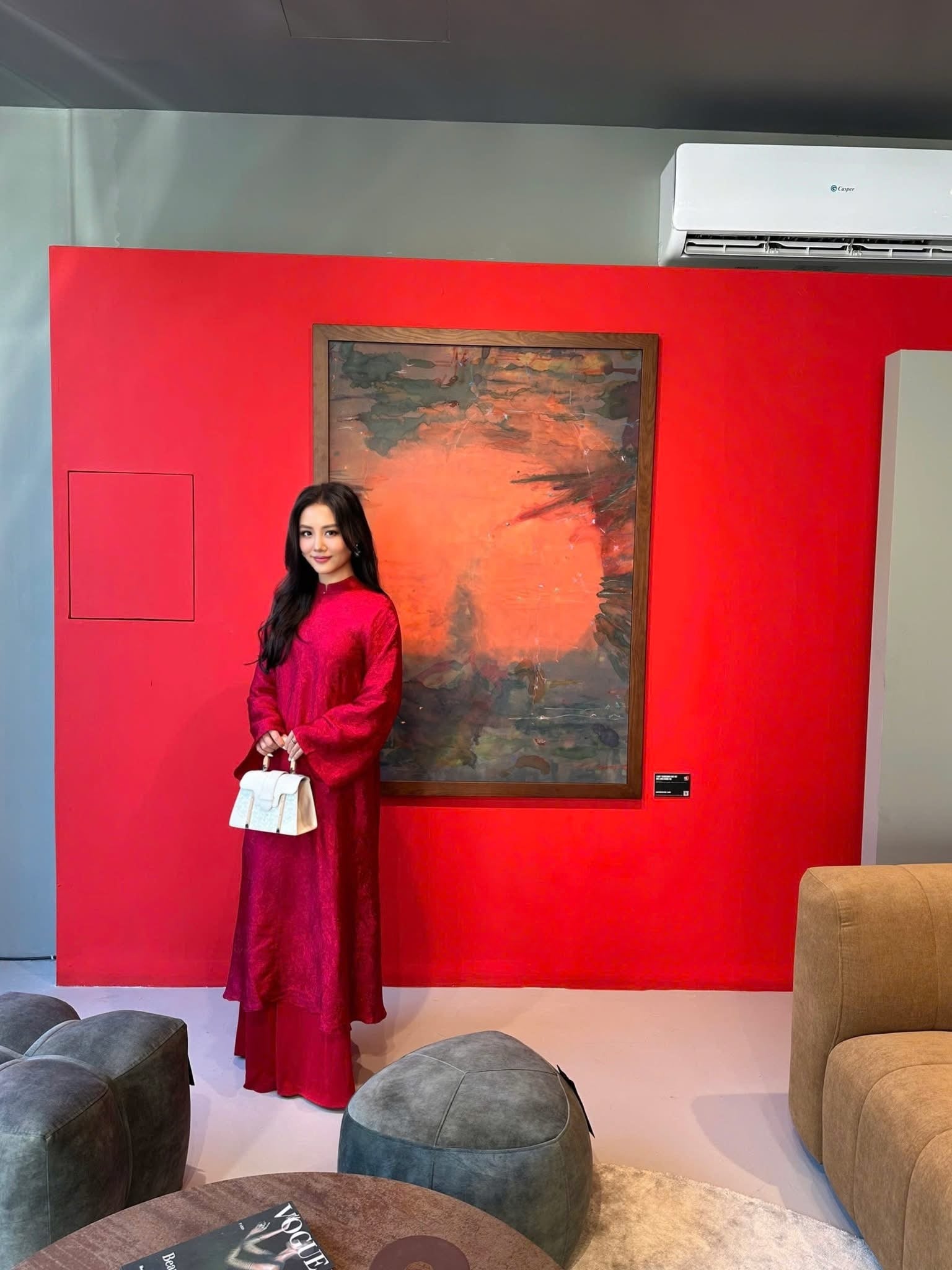 "Hy Loan Ao Dai set in crimson silk by Lalin, traditional Vietnamese dress with modern design."