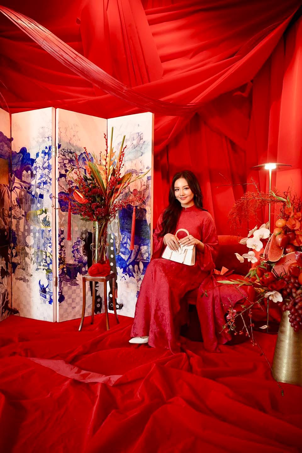 "Hy Loan Ao Dai set in crimson silk, traditional Vietnamese dress by Lalin, cultural heritage attire."