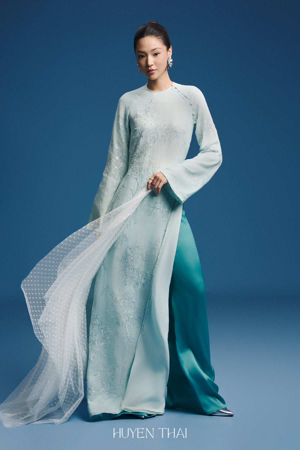 "Uyen My Modern Ao Dai Set in red silk with floral patterns, traditional Vietnamese dress by Huyen Collection."