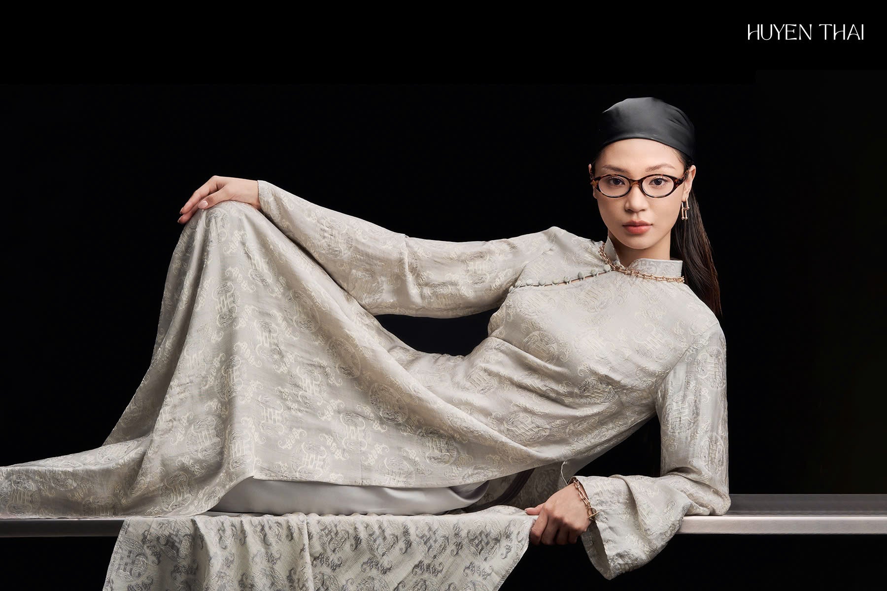 "Elegant 'Bạch Ngọc' Wormsilk Ao Dai in ivory grey silk jacquard, traditional Vietnamese dress by Huyen Collection."