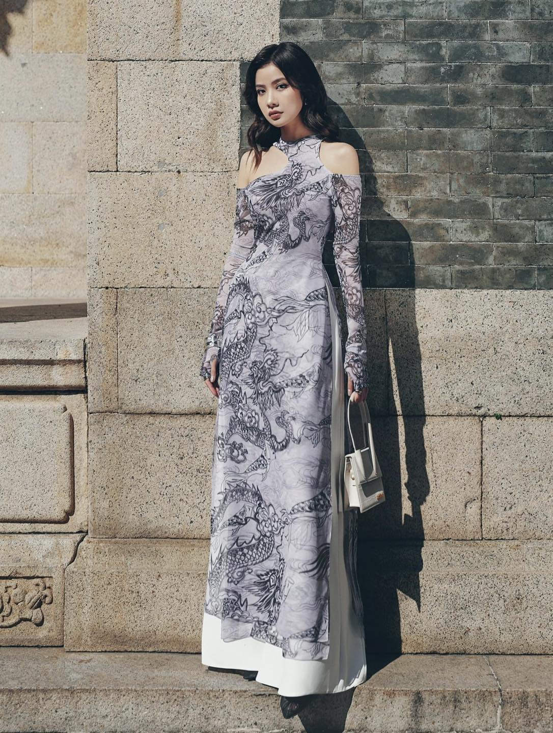 "Jia Chen Tulle Ao Dai Set in black with traditional Vietnamese dragon pattern, modern design by Keira Tong."