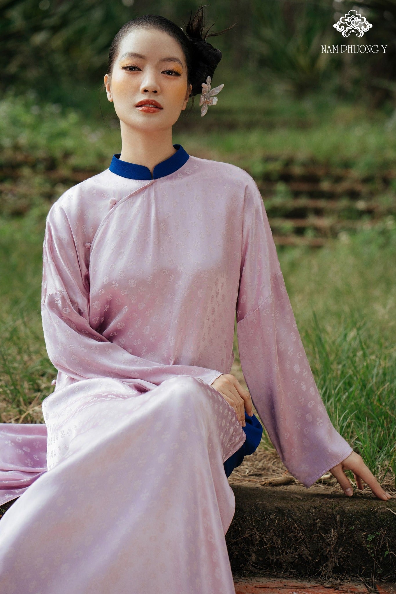 "Y Phuong Luxury Ao dai set in light pink silk with floral jacquard, traditional Vietnamese dress."