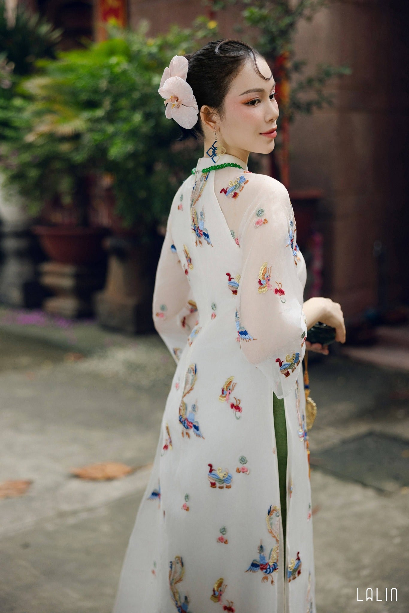 "Khiet Chi Ao dai Set by Lalin, luxury embroidered organza and silk, traditional Vietnamese dress in red and green with floral patterns."