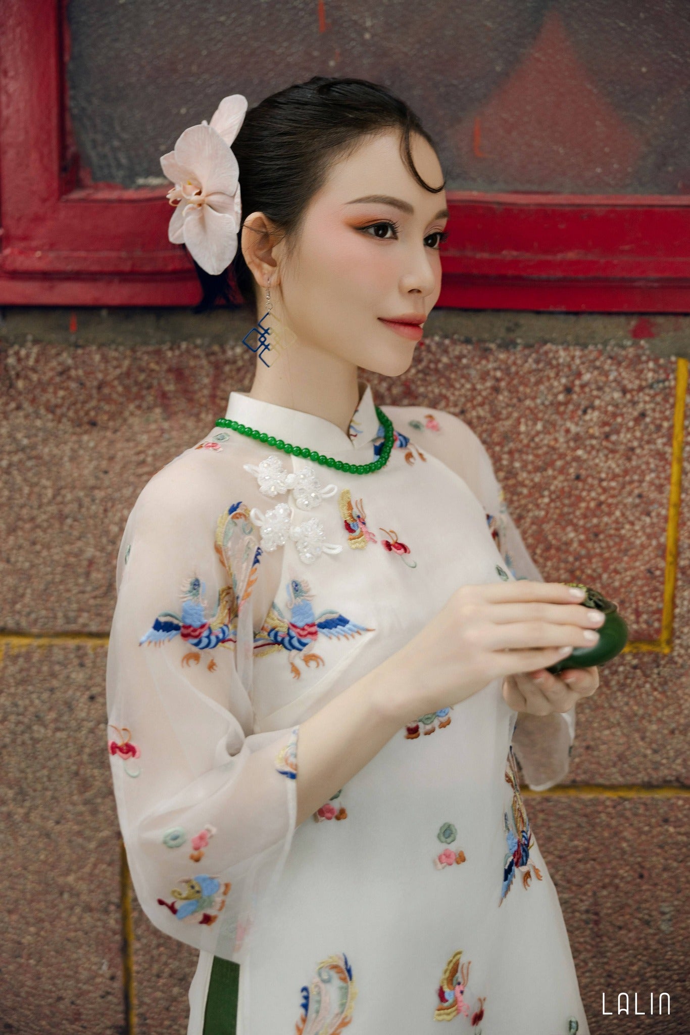 "Khiet Chi Ao dai Set by Lalin, luxury embroidered organza and silk, traditional Vietnamese dress in red and green with floral patterns."