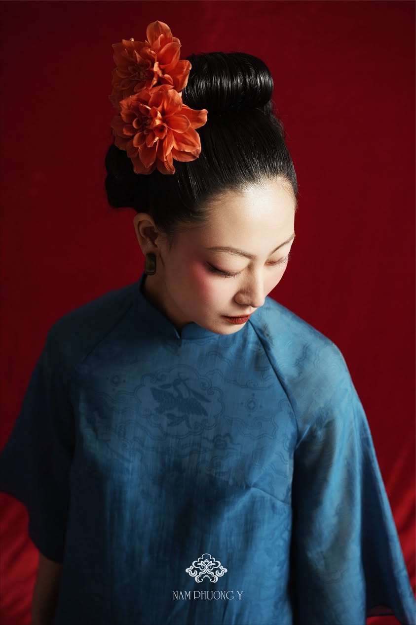 "Ho Phach Royal Jacquard Silk Áo Dài Set in deep teal, traditional Vietnamese dress by Nam Phuong Y, modern woven pattern."