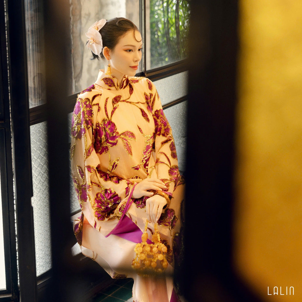 "Traditional Vietnamese Ao dai in violet sequin satin with floral embroidery by Lalin."