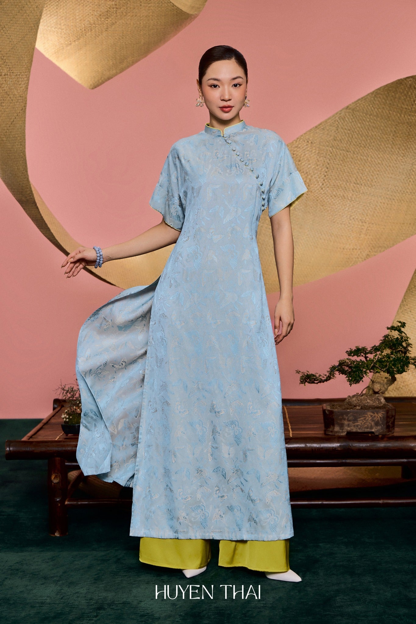 "Traditional Vietnamese Ao Dai 'Nha Lam' in sky blue silk brocade with avocado lining, Huyen Collection"