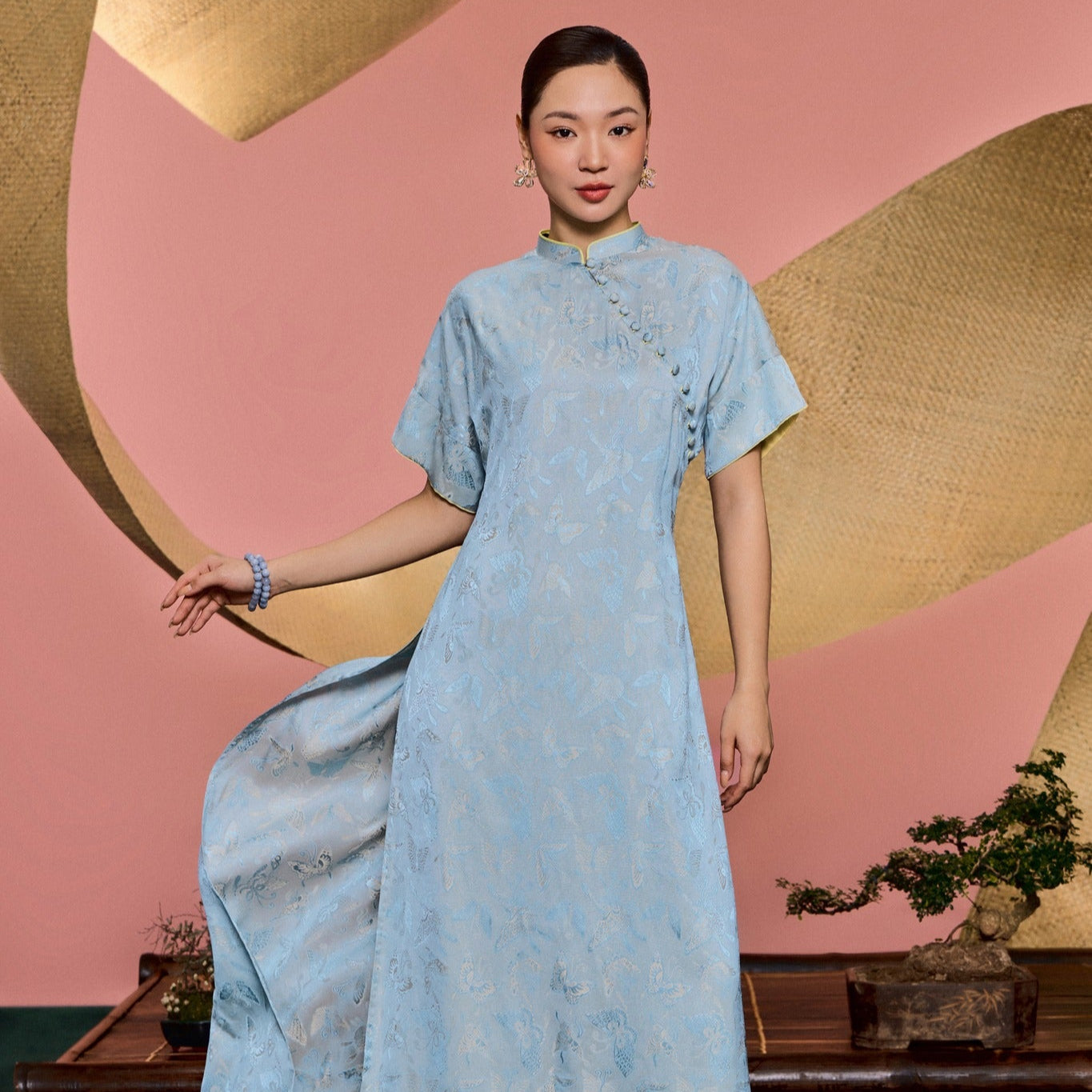 "Traditional Vietnamese Ao Dai 'Nha Lam' in sky blue silk brocade with avocado lining, Huyen Collection"