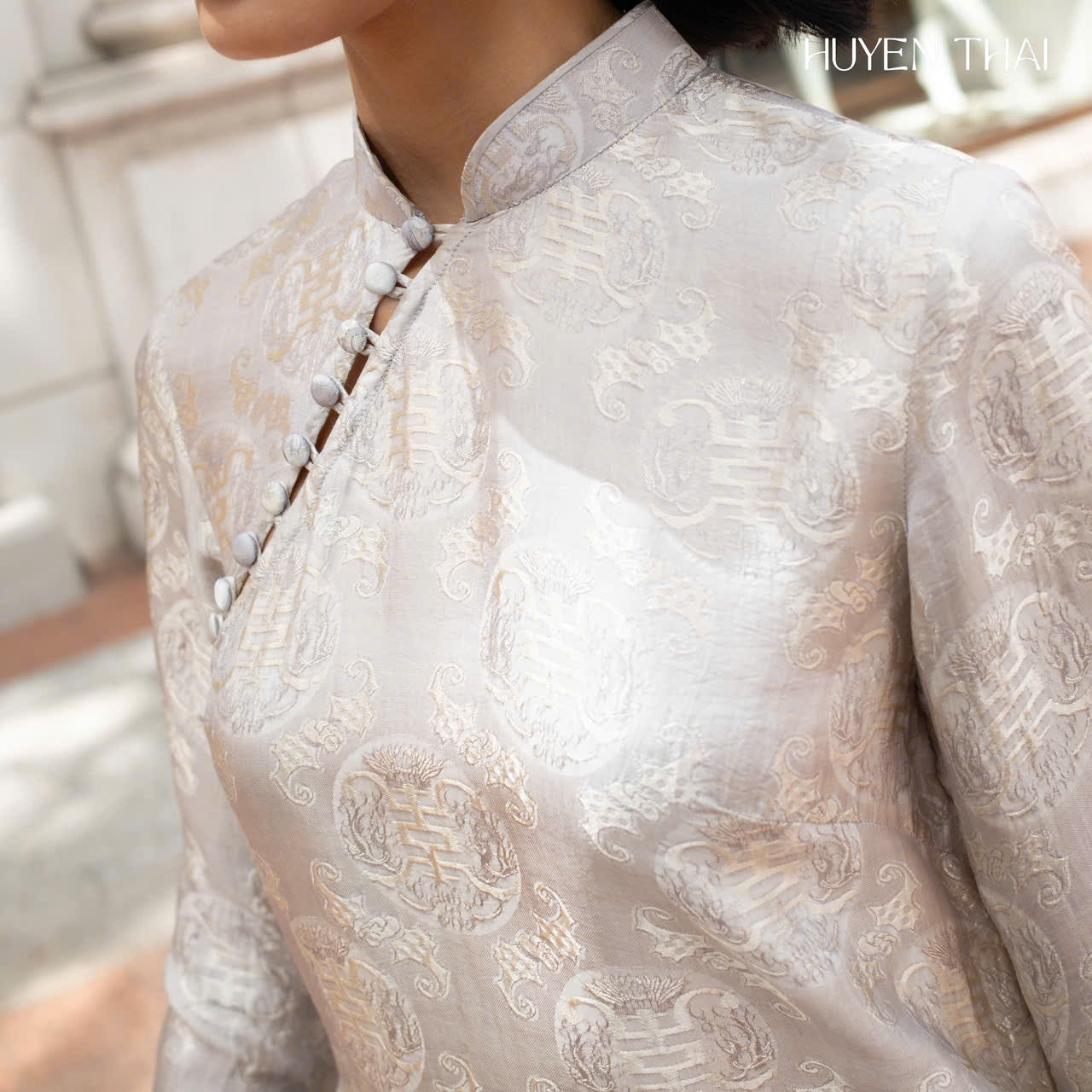 "Bạch Ngọc Wormsilk Ao Dai in ivory grey silk jacquard, traditional Vietnamese dress by Huyen Collection."
