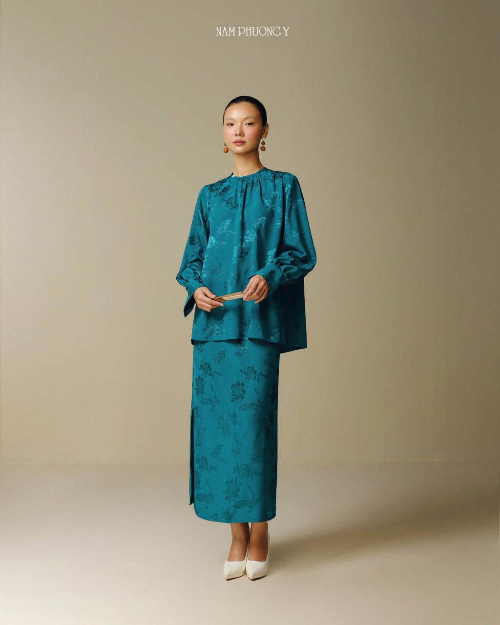 "Traditional Vietnamese dress 'Dong' in dark teal jacquard silk by Nam Phuong Y"