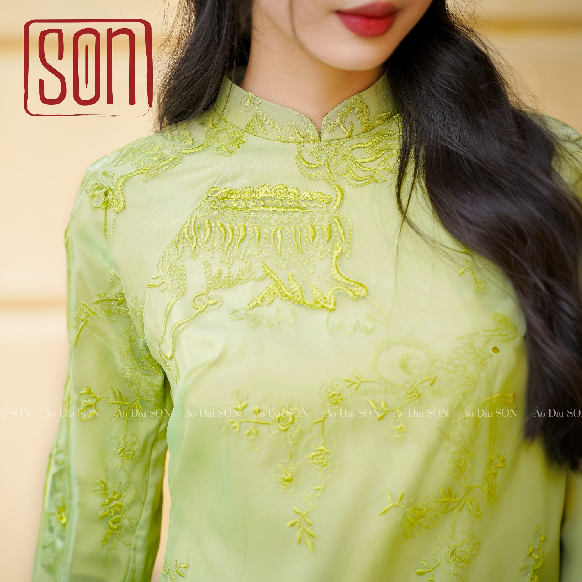 "Yen Son Ao Dai set in avocado green silk with traditional Vietnamese embroidery"