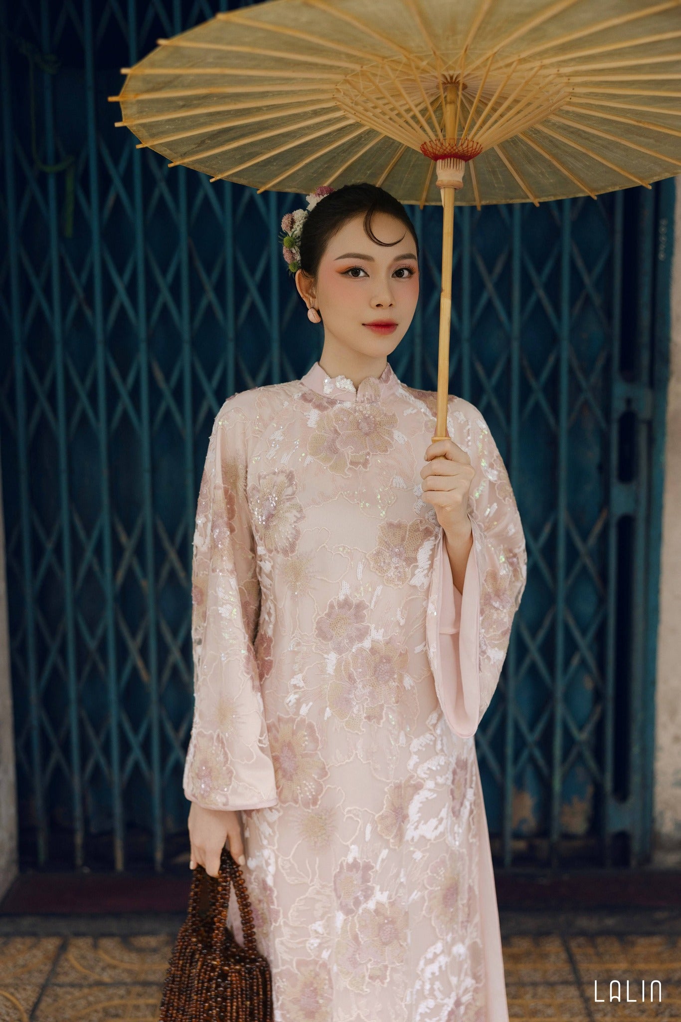 "Kim Sa Ao dai Set by Lalin in soft blush sequined satin, traditional Vietnamese dress with floral pattern."