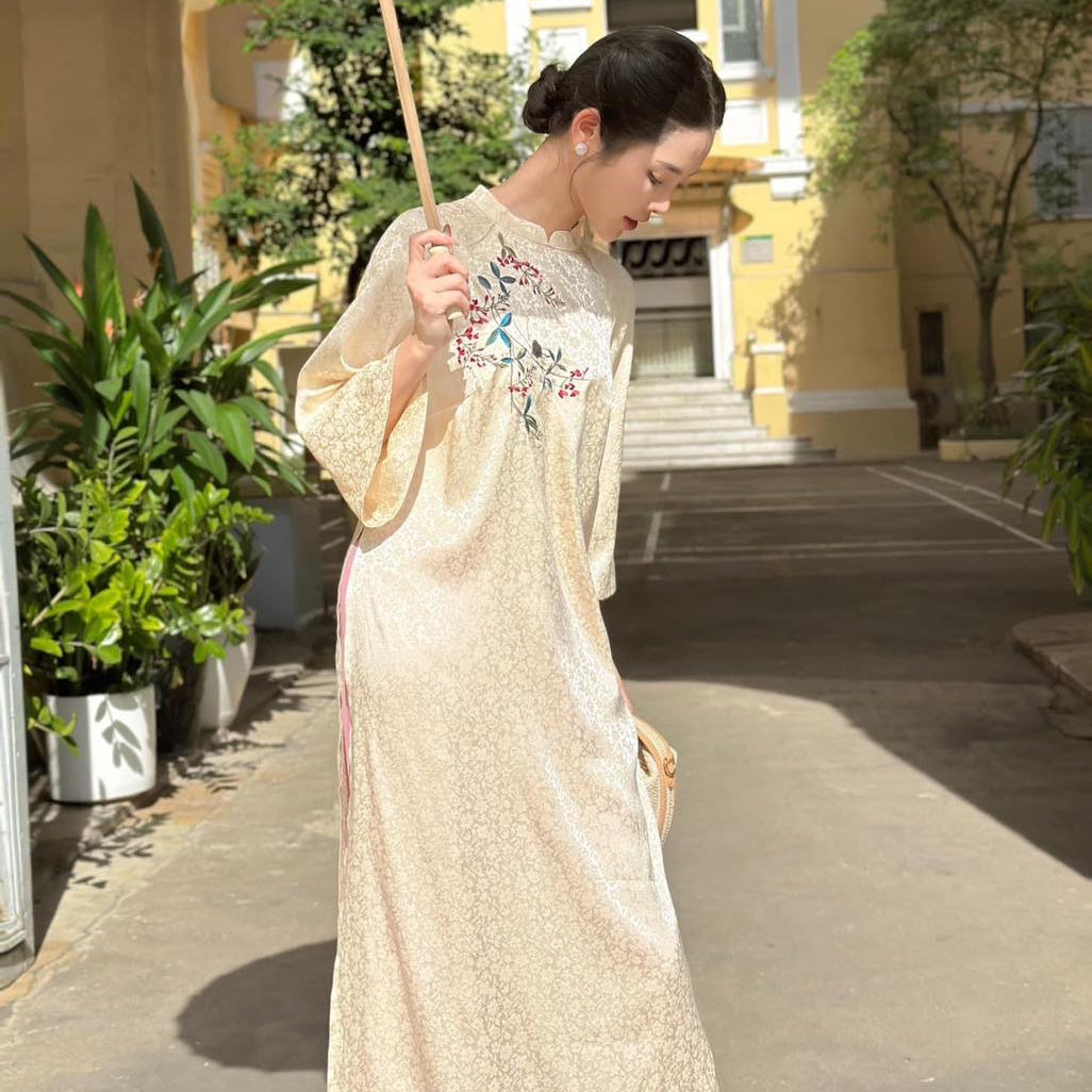 Vietnamese Ao Dai - Ho Diep – Embroidered Áo Dài Set in Cream [Modern cut] - styled presentation in silk in beige by Moc