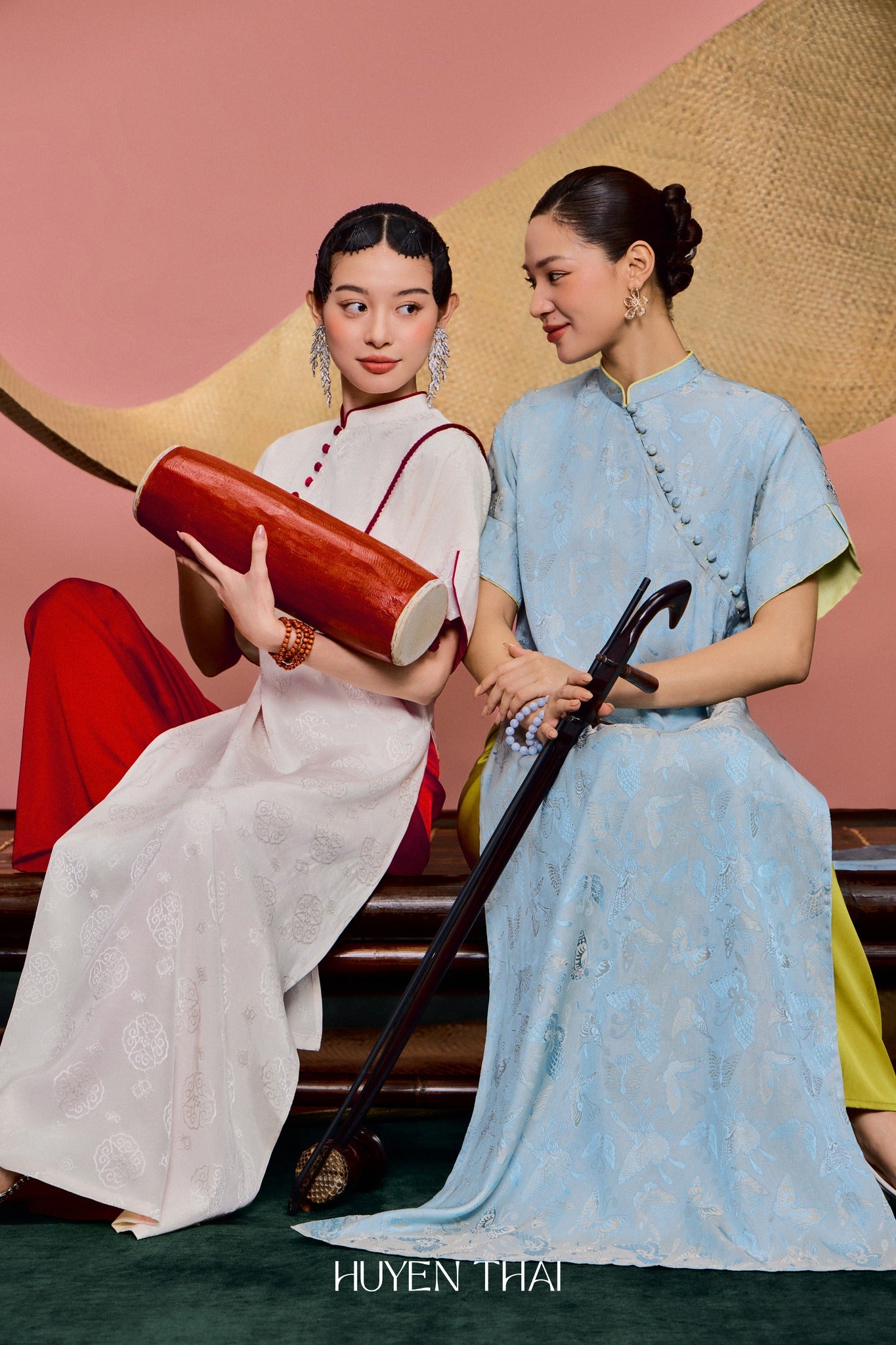 "Van Nha Ao Dai in ivory silk with crimson lining, traditional Vietnamese dress by Huyen Collection."