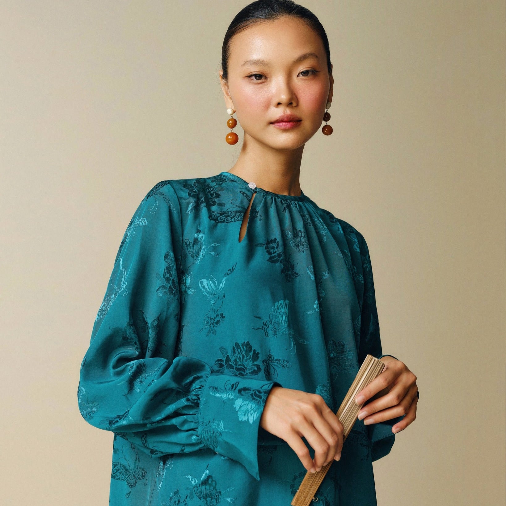 "Traditional Vietnamese dress 'Dong' in dark teal jacquard silk by Nam Phuong Y"