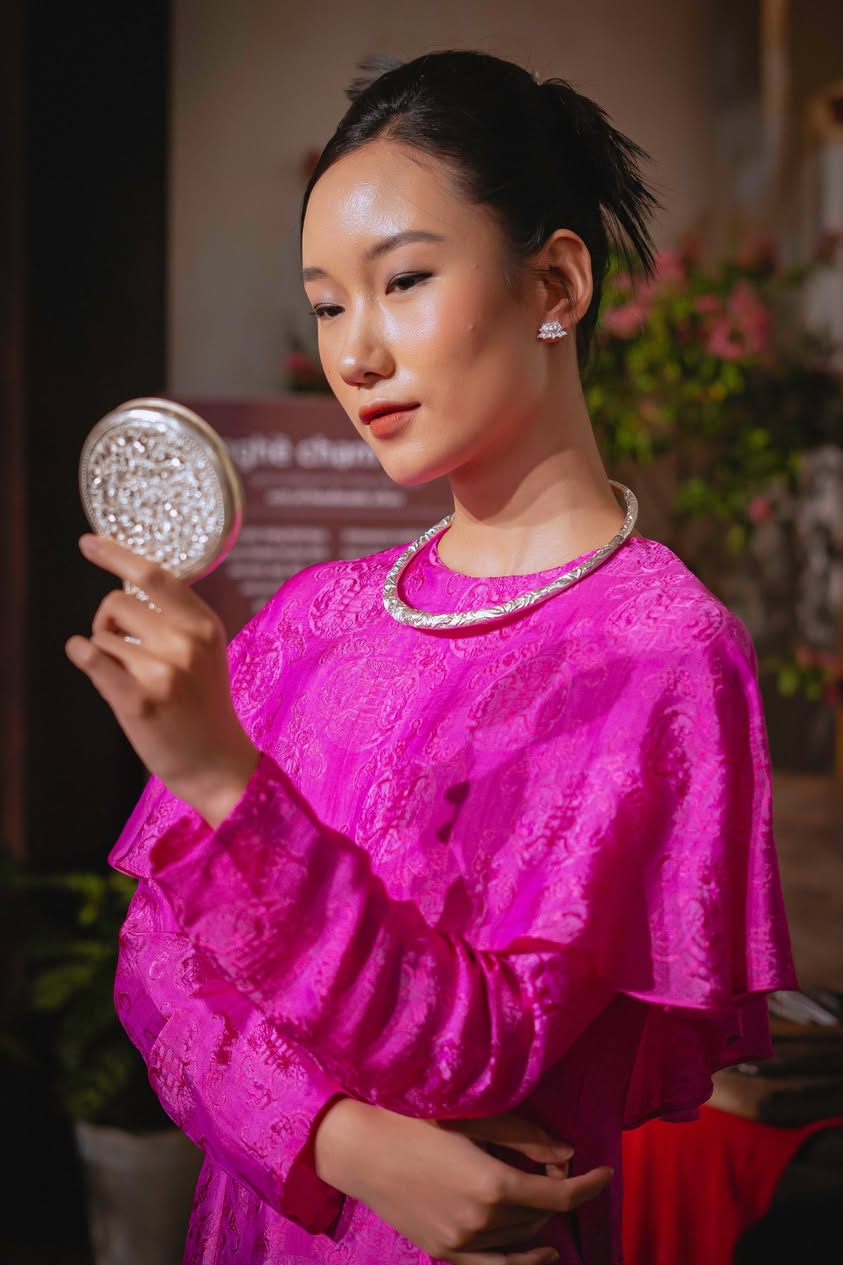 Close-up detail of Bich Lien silver floral stud earrings showing lifelike petal curves and textured stamen center
