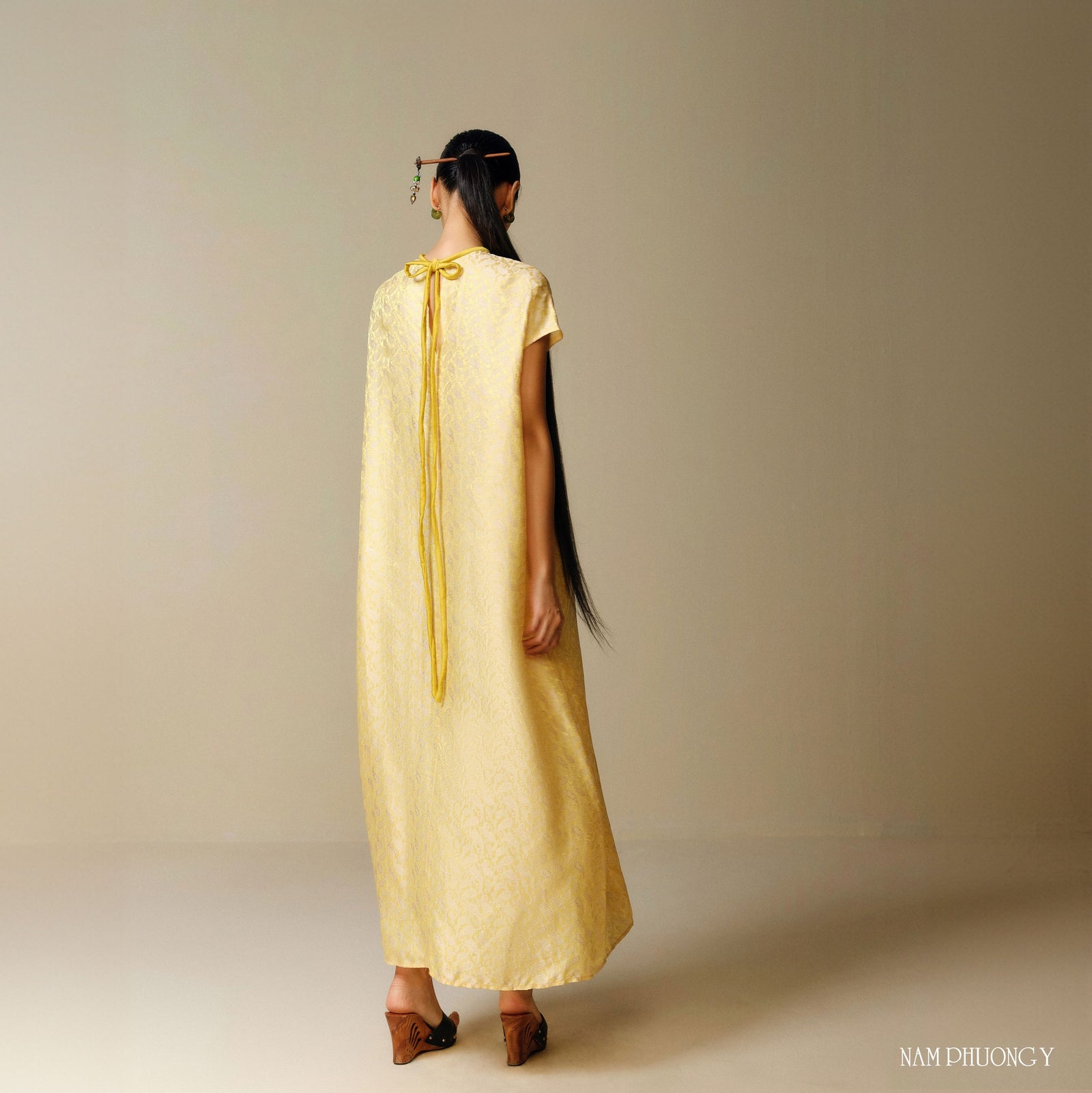 Vietnamese Ao Dai - Hoang Cuc - Premium Worksilk Dress in Blooming Yellow - back view in brocade in yellow by Nam Phuong Y
