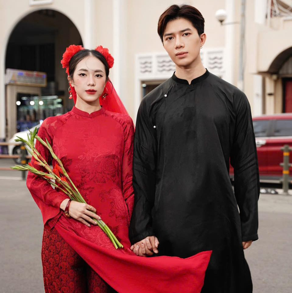 "Traditional Vietnamese Ao Dai for Men in black silk, cultural heritage attire"