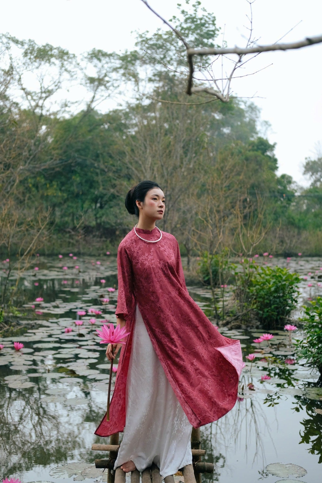 "Khong Tuoc Ao Dai set in dark pink viscose, traditional Vietnamese dress with artisan silk jacquard, modern design."
