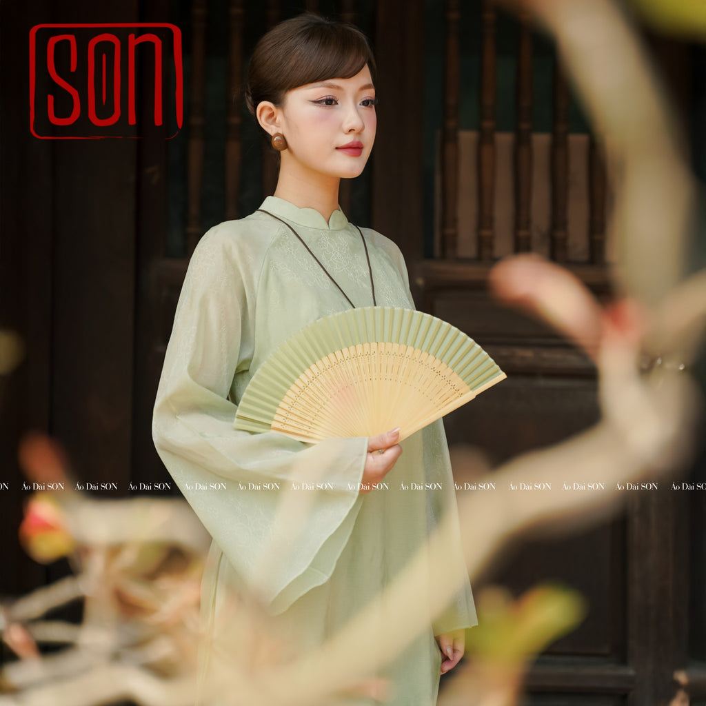 "Thy Son Ao Dai set in light green silk with floral jacquard, traditional Vietnamese dress."