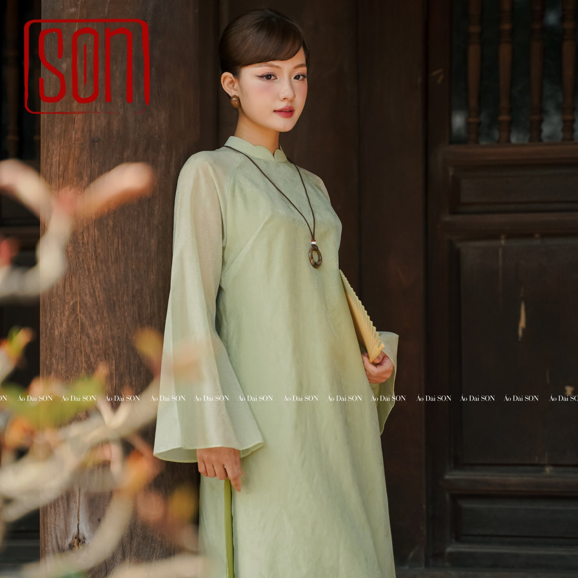 "Thy Son Ao Dai set in light green silk with floral jacquard, traditional Vietnamese dress by SON."