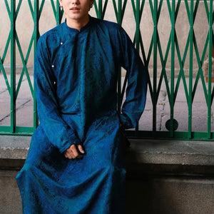 "Loc Tho Ao Dai for Men in dark teal wormsilk, traditional Vietnamese dress with floral jacquard pattern."