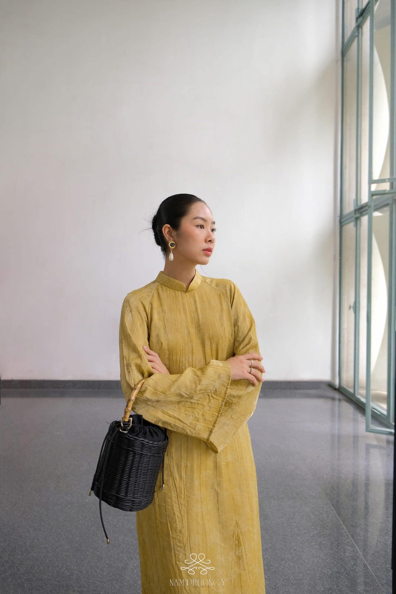 "Hoang Thu Premium Natural Silk Ao dai Set in Ochre by Nam Phuong Y, traditional Vietnamese dress in modern pattern."