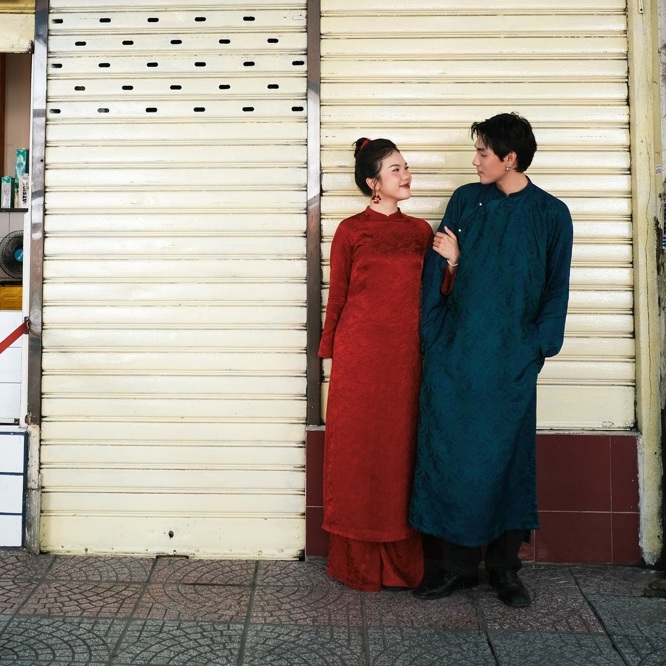 "Loc Tho Ao Dai for Men in dark teal wormsilk, traditional Vietnamese dress with floral jacquard pattern."