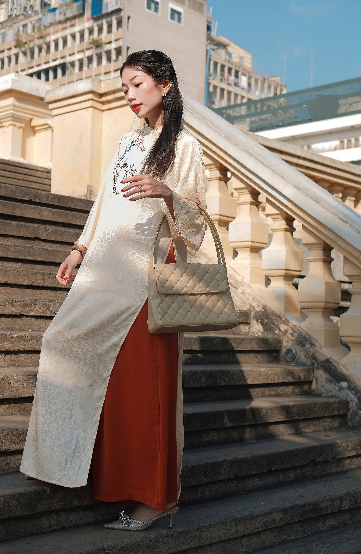 Vietnamese Ao Dai - Ho Diep – Embroidered Áo Dài Set in Cream [Modern cut] - styled presentation in silk in beige by Moc