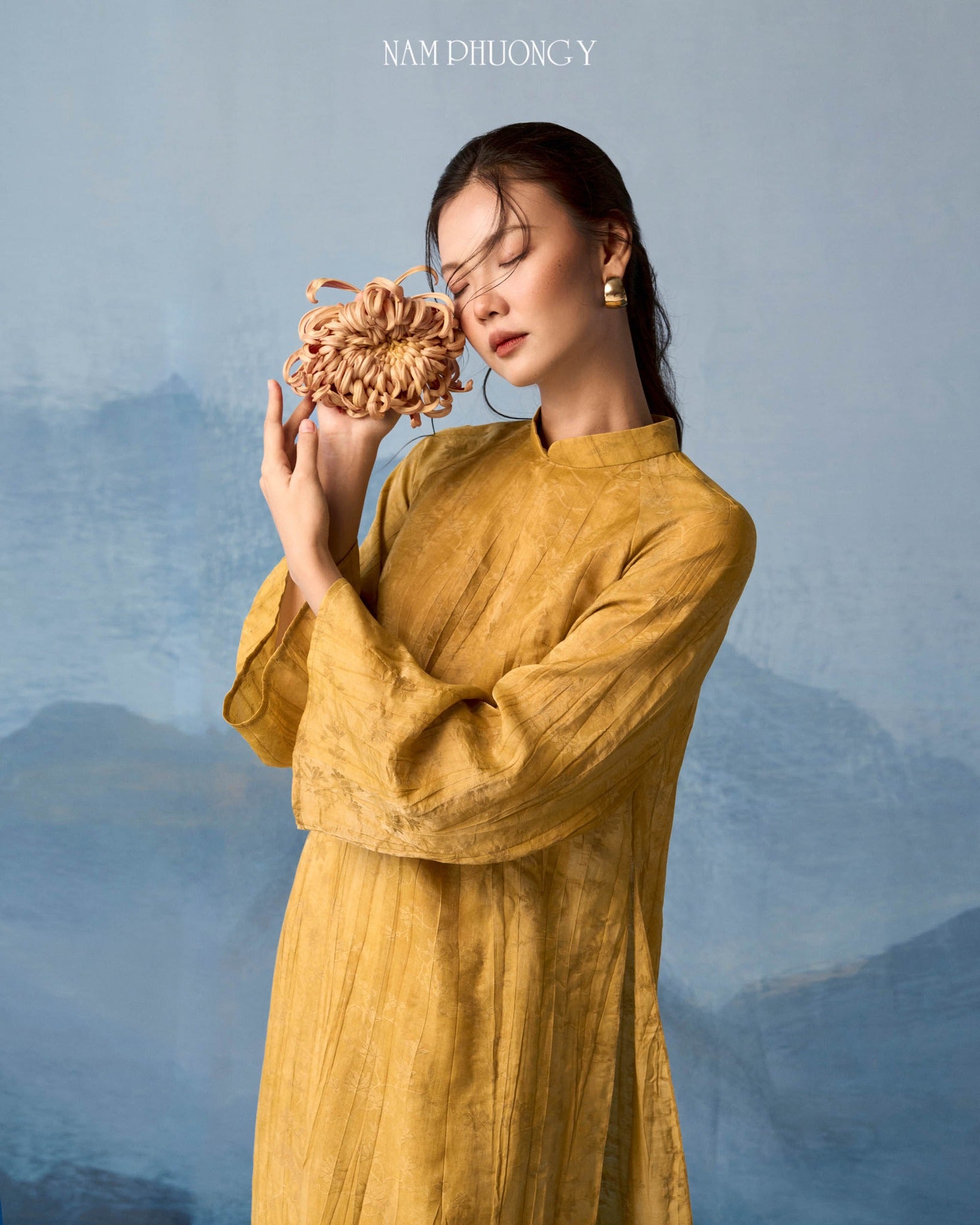 "Hoang Thu" premium silk Ao dai set in ochre by Nam Phuong Y, traditional Vietnamese dress.