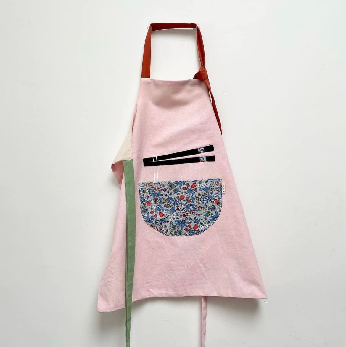 "Phở Apron – Handmade Vietnamese cotton apron in red with floral pattern, Bat-trang inspired."