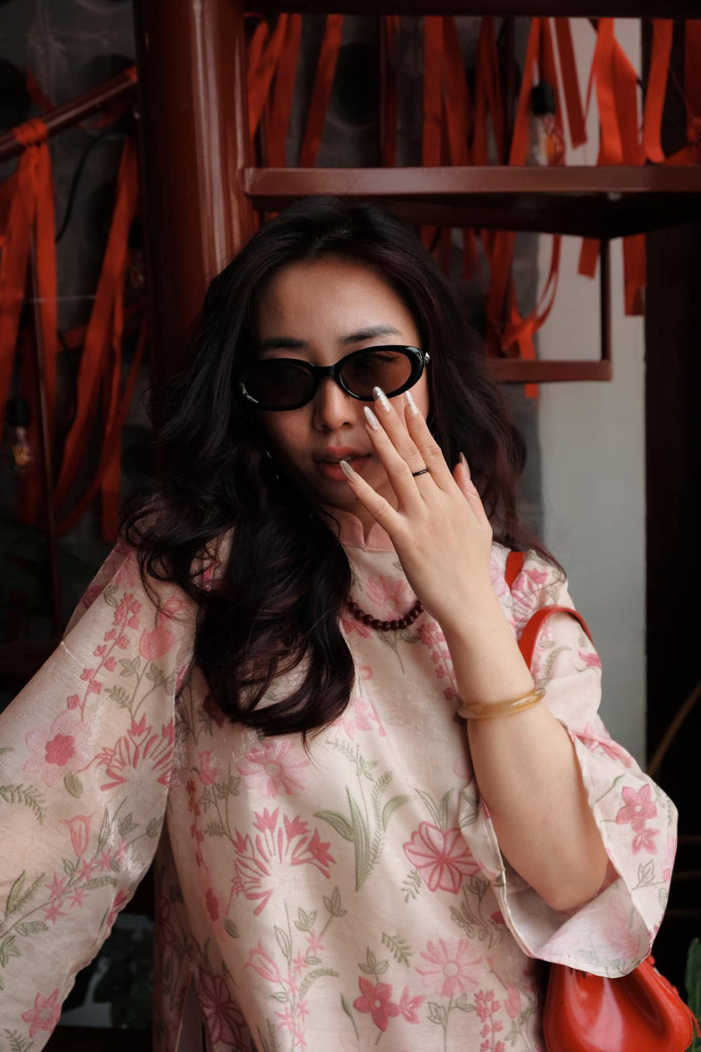 "Thieu Hoa Jacquard Ao Dai Set in pink silk with floral embroidery, traditional Vietnamese dress."