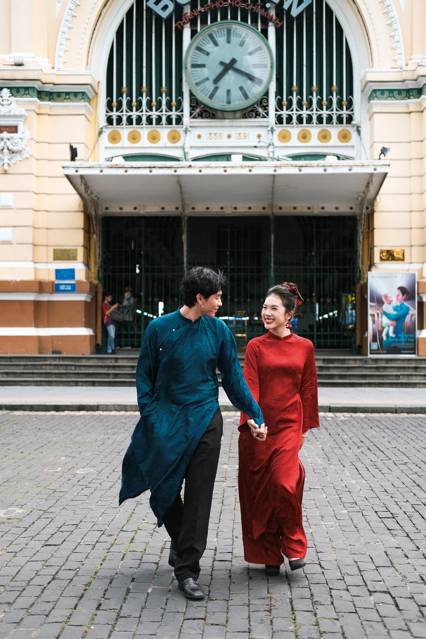 "Loc Tho Ao Dai for Men in dark teal wormsilk with floral jacquard, traditional Vietnamese dress."