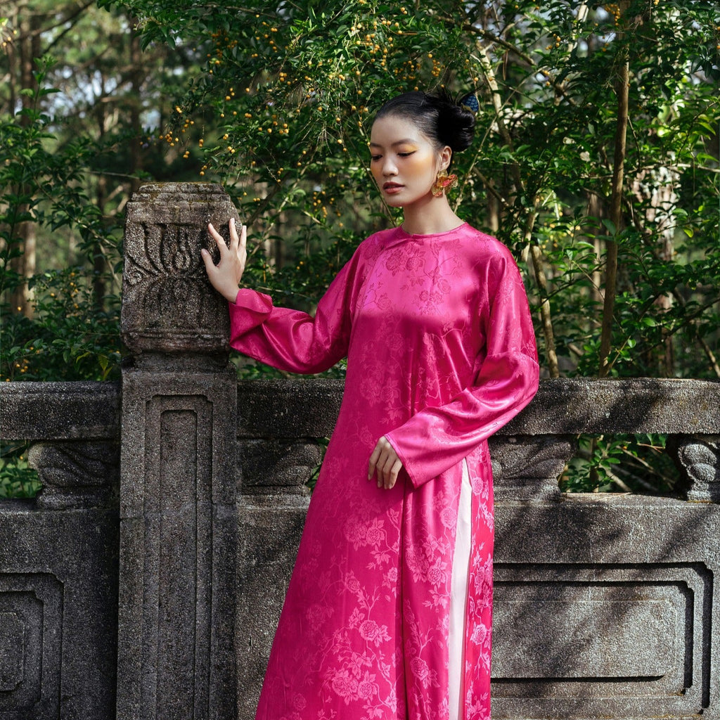 Bich Dao premium brocade silk Ao Dai in radiant peach-pink with delicate floral patterns - Vietnamese traditional dress