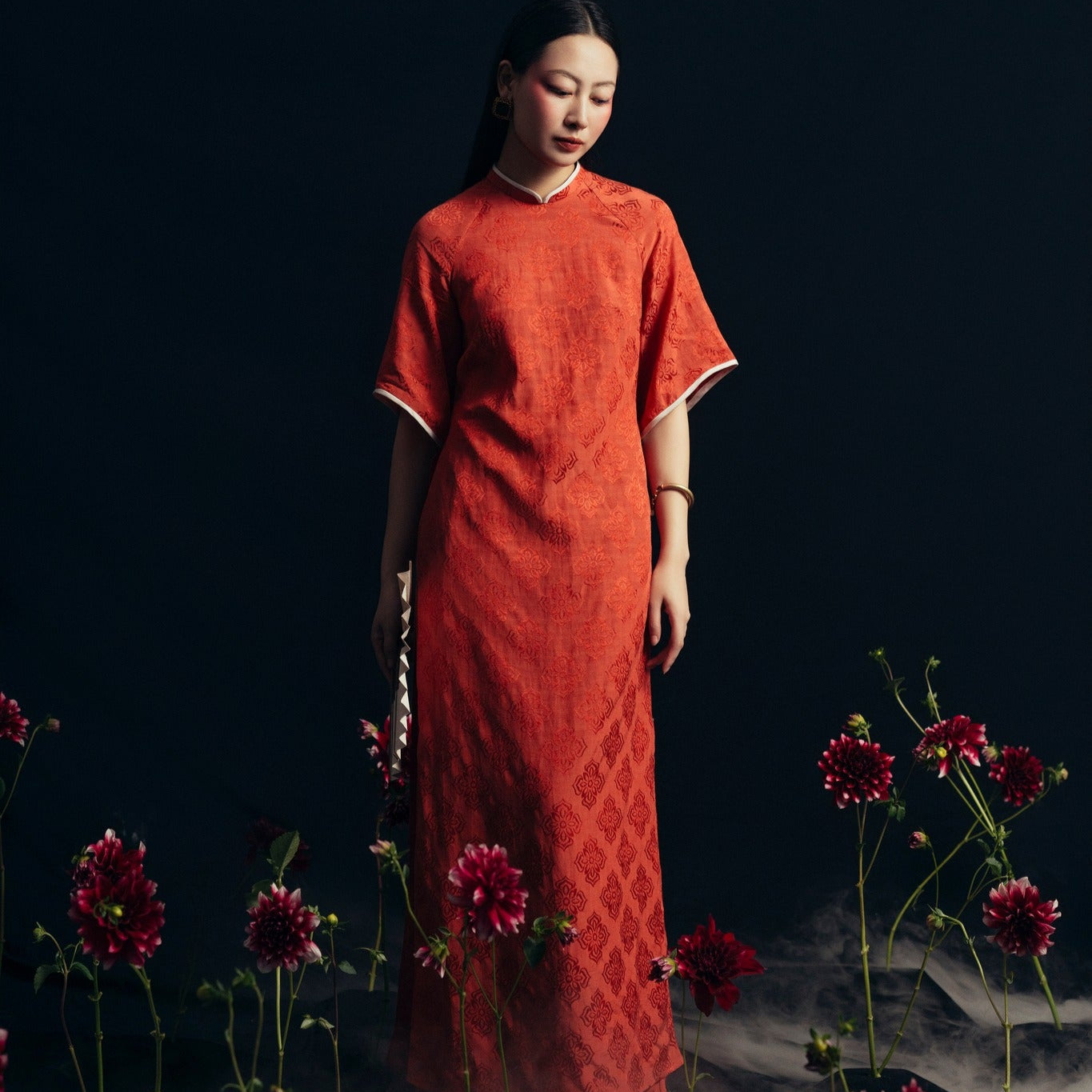 "Xich Lien Luxury Ao dai in orange silk, traditional Vietnamese dress by Nam Phuong Y"