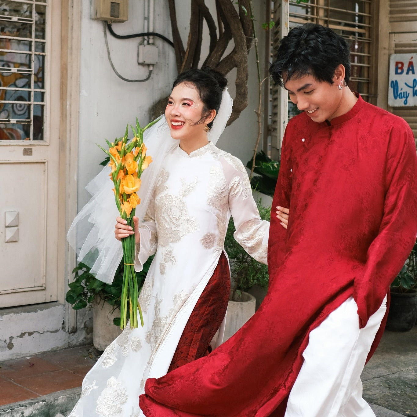 "Loc Tho Ao Dai for Men in crimson wormsilk with floral jacquard, traditional Vietnamese attire by Moc."