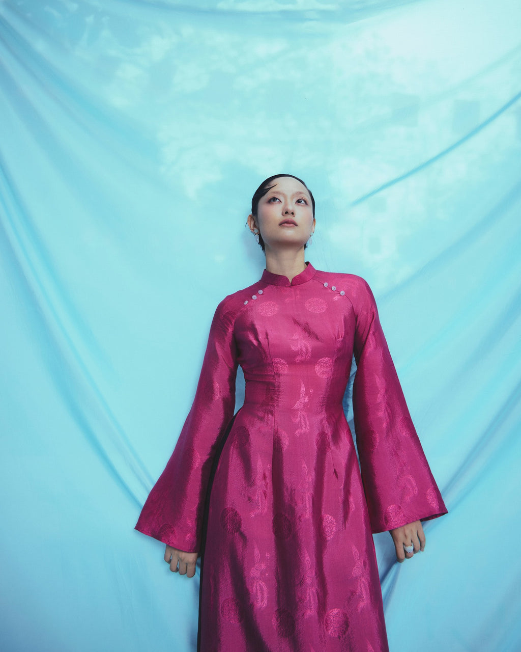 "Phuong Cac" Royal Jacquard Silk Ao Dai in deep dark magenta, traditional Vietnamese dress.