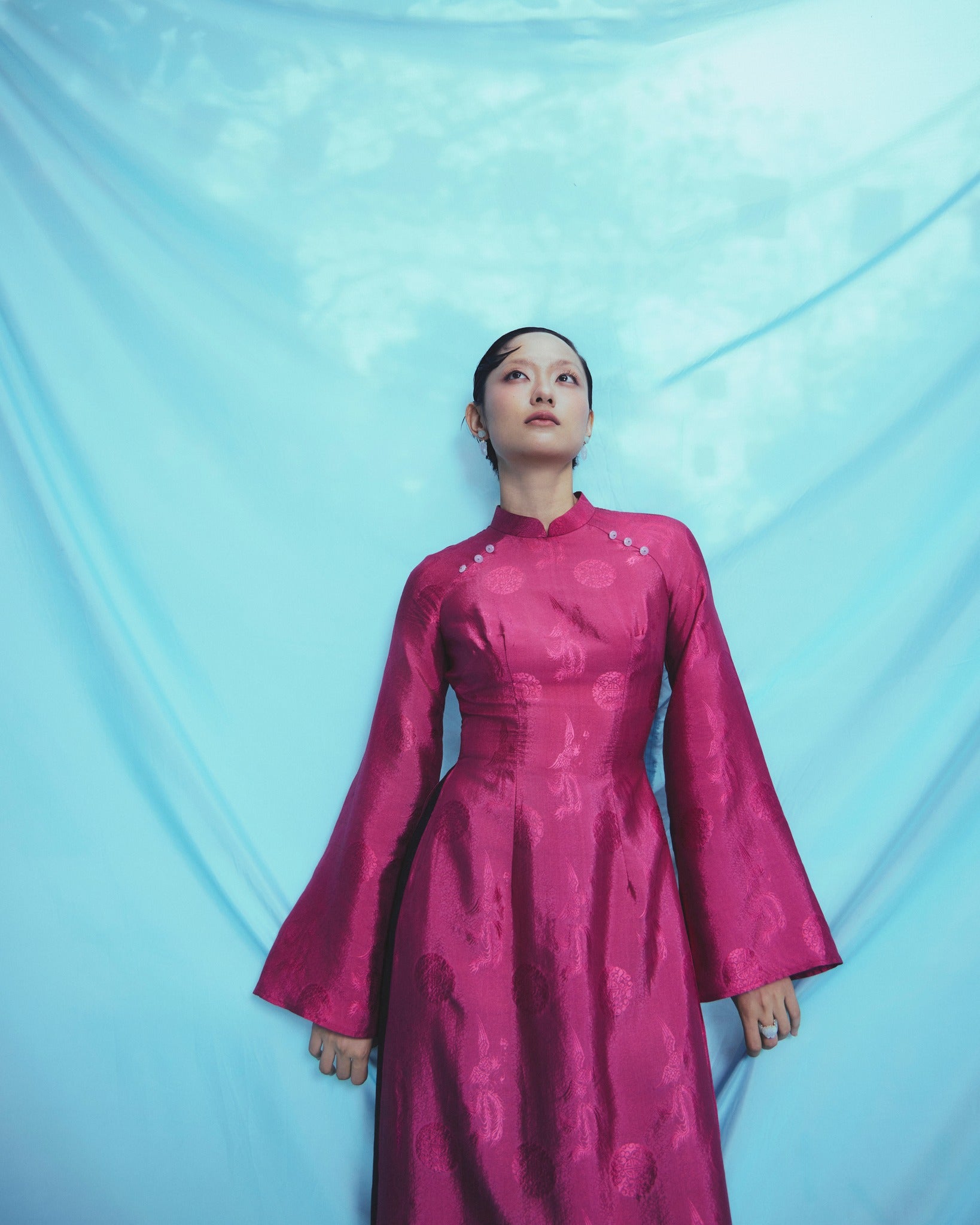 "Phuong Cac" Royal Jacquard Silk Ao Dai in deep dark magenta, traditional Vietnamese dress.