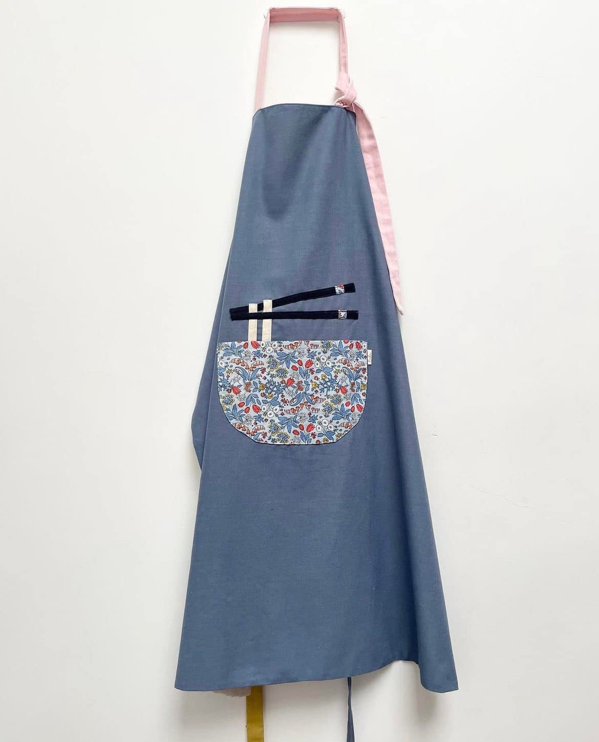 "Phở Apron – Handmade Vietnamese cotton apron in red with floral pattern, by Bat-trang."