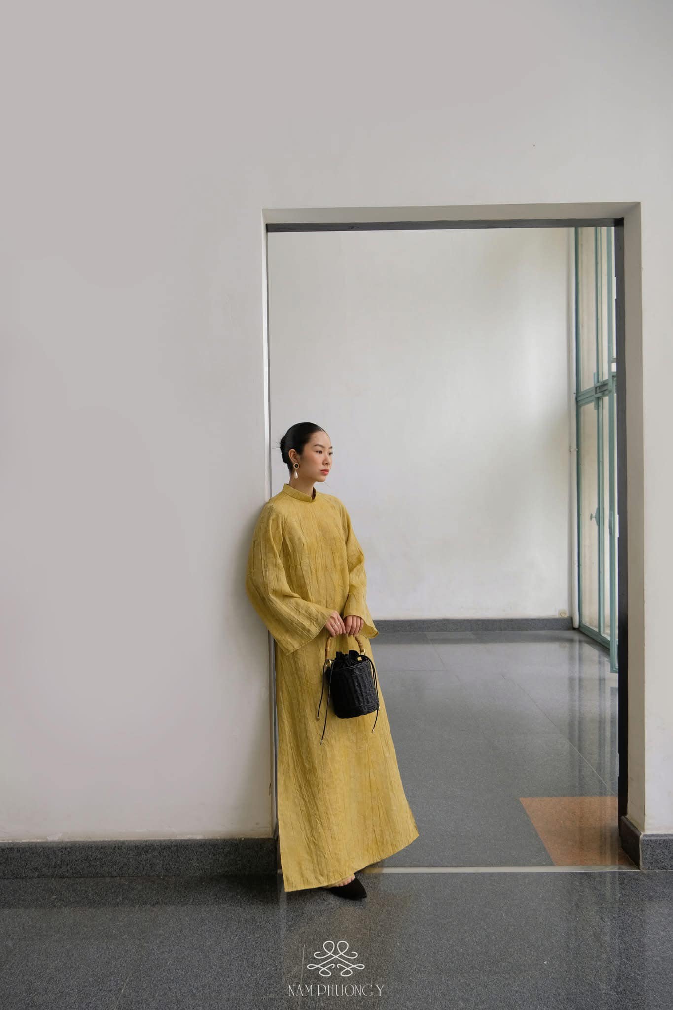 "Hoang Thu Premium Natural Silk Ao dai Set in Ochre by Nam Phuong Y, traditional Vietnamese dress in gold silk."