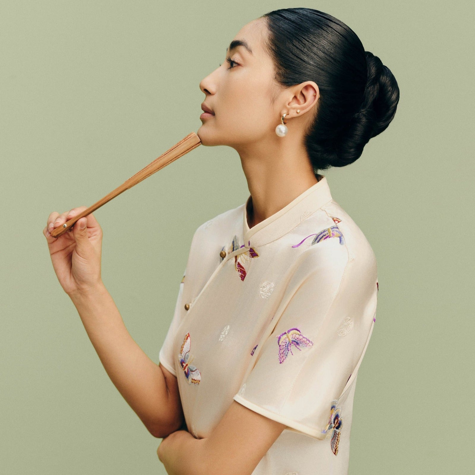 Tú Điệp - Premium Short-sleeve Embroidered Áo Dài Set in Ivory Silk - side profile by Nam Phuong Y